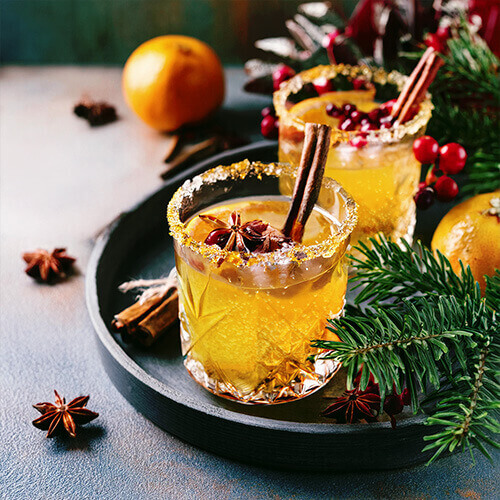 Drinkmate Getränkesprudler: Beitragsbild mit zwei Gläsern für X-Mas-Orange-Bliss-Rezept